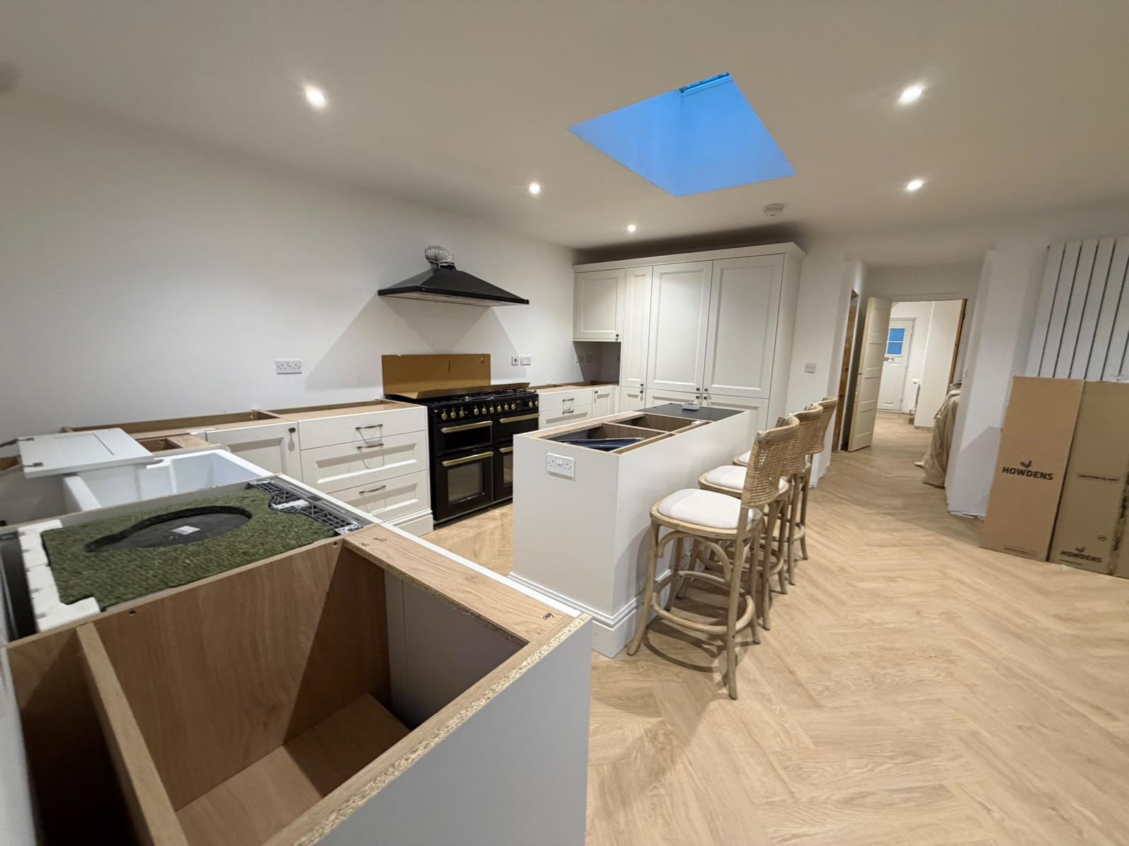 Kitchen island with oven, downlights and a roof lantern